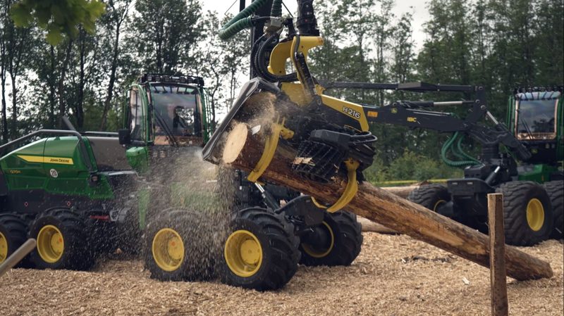 John Deere forestry machine in action at the DonauWald trade show booth